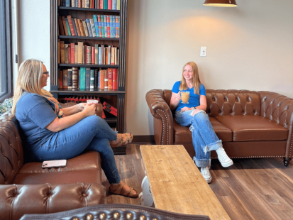 Two guests enjoying their coffee at MC Coffee House